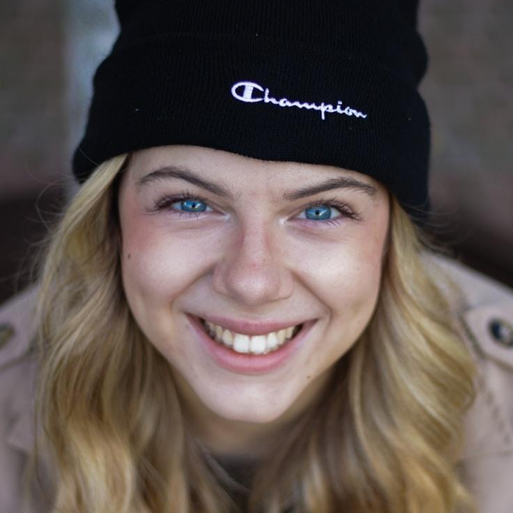 Kaveri Mehta, Lead Design Curator at River Stone Park, reviewing corporate floral arrangements